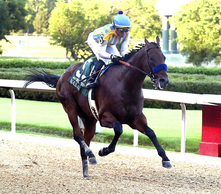 In this May 2, 2020, file photo, jockey Joel Rosario and Nadal cross the wire to win the second division of the Arkansas Derby horse race at Oaklawn in Hot Springs, Ark. Nadal, who now won't have a shot after an ankle injury in training last week, could have been racing to become trainer Bob Baffert's third Triple Crown winner in six seasons, if not for the coronavirus pandemic. The Belmont Stakes usually wraps up a five-week span that includes the Kentucky Derby and the Preakness. All have been pushed back, though the Belmont Stakes will now go first on June 20. (Richard Rasmussen/The Sentinel-Record via AP, File)