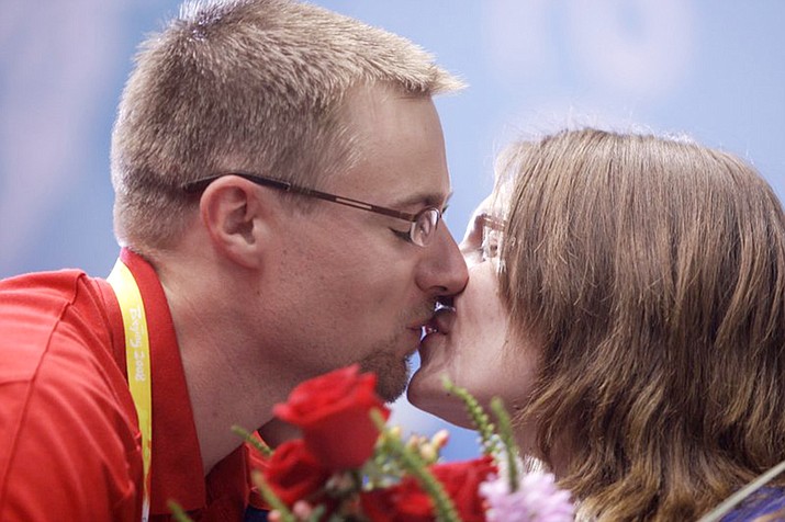 Czech Republic's Katerina Emmons is congratulated by her husband Matt Emmons after winning a gold medal during the womens 10 meter air rifle final round at the Beijing Olympics. Emmons made one of the biggest gaffes in Olympic history, inadvertently shooting at the wrong target to cost himself what appeared to be a sure gold medal. But with that disappointment came joy: He met his future wife, a Czech Republic shooter, after she came over to console him. (AP Photo/Sergey Ponomarev, File)