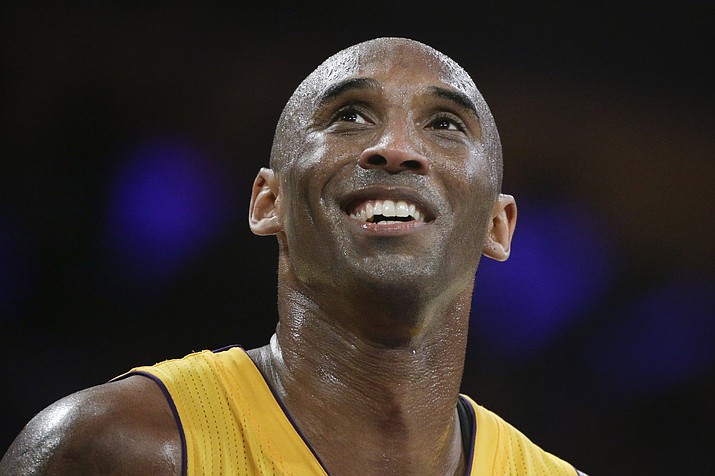 In this April 13, 2016, file photo, Los Angeles Lakers forward Kobe Bryant smiles during the first half of his last NBA basketball game, against the Utah Jazz in Los Angeles. The Naismith Memorial Basketball Hall of Fame was gearing up for a great year: not just the certain election of NBA superstars like Kobe Bryant, Kevin Garnett and Tim Duncan, but also a chance to unveil a completely renovated museum. Because of the coronavirus outbreak, the reopening has been pushed back two months to July 1 and the induction ceremony is being postponed, either to October or the spring. (Jae C. Hong/AP, file)