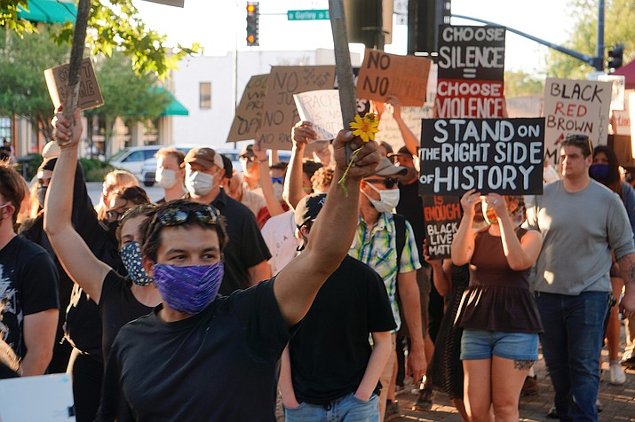 Protesters march at the courthouse plaza Tuesday, June 2, 2020, in downtown Prescott. (Aaron Valdez/Courier)