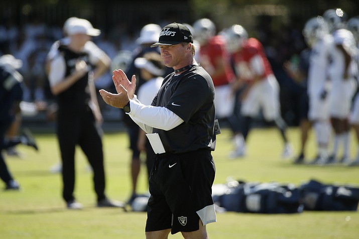 In this Aug. 8, 2019, file photo, Raiders head coach Jon Gruden claps during a combined NFL football training camp with the Rams, in Napa, Calif. Commissioner Roger Goodell told the 32 NFL clubs on Thursday, June 4, 2020, that coaching staffs are allowed to return to team facilities starting Friday. (Eric Risberg/AP, file)