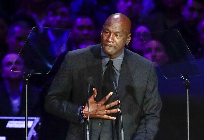 In this Feb. 24, 2020, file photo, former NBA player Michael Jordan reacts while speaking during a celebration of life for Kobe Bryant and his daughter Gianna in Los Angeles. Jordan is "deeply saddened, truly pained and plain angry." With protesters taking to the streets across the United States again Sunday, May 31, Jordan released a statement on George Floyd and the killings of black people at the hands of police. (AP Photo/Marcio Jose Sanchez, File)