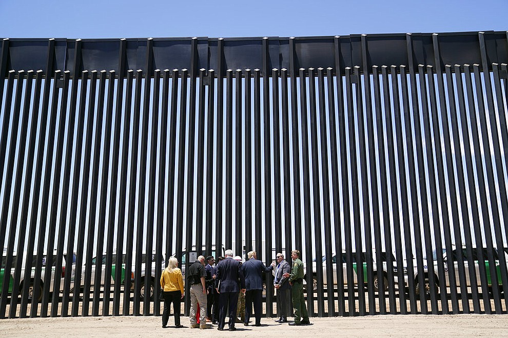 President Donald Trump tours a section of the border wall, Tuesday, June 23, 2020, in San Luis, Ariz. (AP Photo/Evan Vucci)