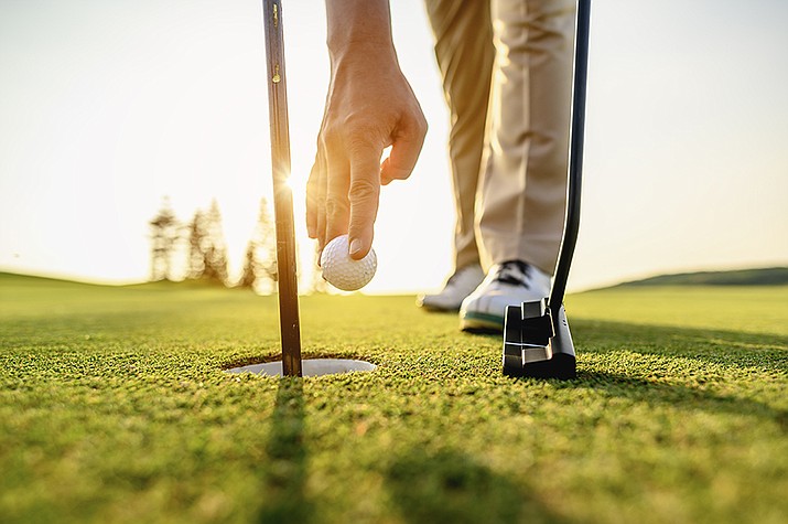 Begin reading the green and lining up your putt as soon as you reach the green. Don’t wait until it’s your turn to start analyzing your putt. (Adobe stock art)