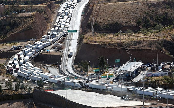 Trucks line up on the Mexico side of the border to enter the U.S. through the Mariposa Port of Entry near Nogales in this 2011 photo. Trade with Mexico is worth billions of dollars and thousands of jobs to Arizona, and business leaders hope the new United States-Mexico-Canada Agreement will mean even more (photo/Donna Burton/US Customs and Border Protection)