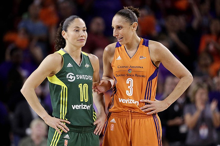 In this Sept. 6, 2017 file photo, Phoenix Mercury guard Diana Taurasi (3) talks with Seattle Storm guard Sue Bird (10) during the second half of a WNBA basketball playoff game in Tempe, Ariz. Taurasi and Bird know that they are on the tail end of their incredible basketball careers. After both stars missed last season due to injuries, skipping the 2020 season could have meant the end of their illustrious careers because it would have been difficult to return after two years off according to them. (Matt York, AP file)