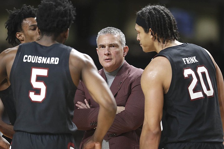 In this March 7, 2020, file photo, South Carolina head coach Frank Martin talks to Jermaine Couisnard (5) and Alanzo Frink (20) in the second half of an NCAA college basketball game against Vanderbilt in Nashville, Tenn. Martin is joining dozens of college basketball coaches in taking action on racism and diversity. The NABC announced Martin would chair a new committee designed to address issues of race and discrimination and not only within college sports. (AP Photo/Mark Humphrey, File)
