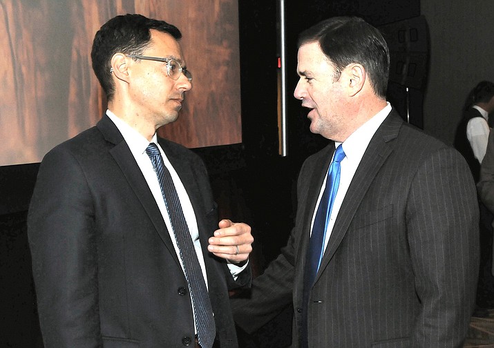 Gov. Doug Ducey, right, chats earlier this year with Glenn Hamer, president of the Arizona Chamber of Commerce and Industry at a chamber-sponsored event. (Capitol Medis Services file photo by Howard Fischer)