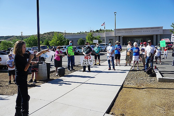 Mary Beth Hrin, an opponent of Yavapai County’s plans to build a new jail in Prescott, talks to a crowd of protesters who gathered at the Yavapai County Juvenile Justice Center Friday, July 17, 2020. (Cindy Barks/Courier)