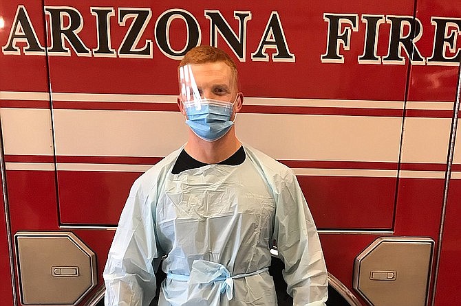 Central Arizona Fire and Medical Authority (CAFMA) firefighter Zach Ducharme, in March 2020, wears the personal protective equipment recommended for when dealing with a potentially contagious patient. (CAFMA/Courtesy)