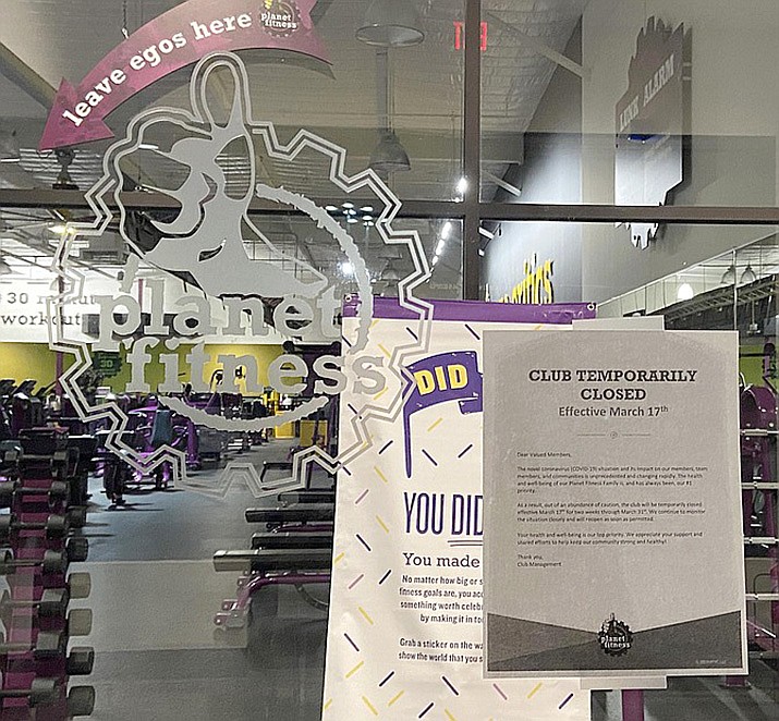 A sign adorns the door to a Planet Fitness location in the Verde Valley earlier this year. In an extensive order Tuesday, Maricopa County Superior Court Judge Timothy Thomason said it was wrong for Gov. Doug Ducey to shut down these facilities indefinitely without a chance to appeal. VVN file/Bill Helm