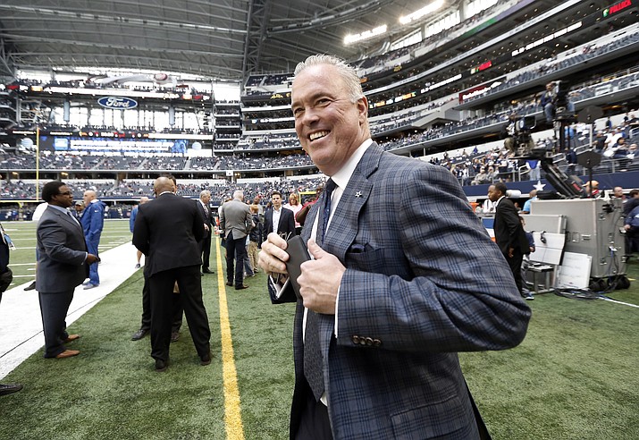 In this Nov. 2, 2014, file photo, Dallas Cowboys' Stephen Jones, executive vice president and director of player personnel, walks on the field before the first half of an NFL football game against the Arizona Cardinals in Arlington, Texas. The cancellation of college football games will have a far more significant impact on the NFL beyond giving the league an opportunity to play Saturday games this fall. (Brandon Wade/AP, file)