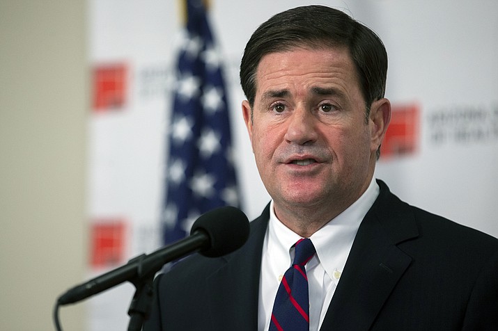 Gov. Doug Ducey speaks during a press conference regarding the COVID-19 pandemic Aug. 13, 2020, at the Arizona Department of Health Services in Phoenix. Ducey has accepted a federal offer of an extra $300 a week in unemployment benefits to more than 370,000 Arizonans out of work to replace the $600 payments that expired at the end of last month. (Sean Logan/The Arizona Republic via AP)