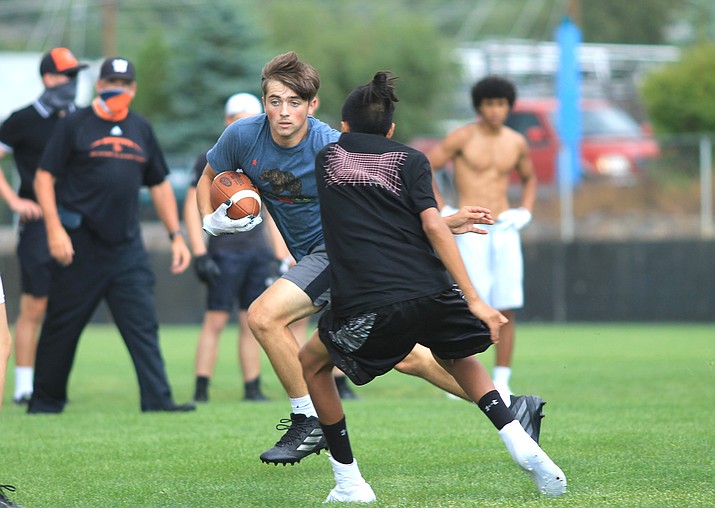 Junior Drew Logan runs around a defender during a preseason practice at Williams High School Aug. 26. The Vikings first official practice is Sept. 7. (Wendy Howell/WGCN)