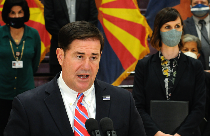 Gov. Doug Ducey said Thursday it's up to Congress and not the state to deal with the fact that unemployment assistance is on the verge of being cut by more than half. With him is state schools chief Kathy Hoffman. (Capitol Media Services photo by Howard Fischer)