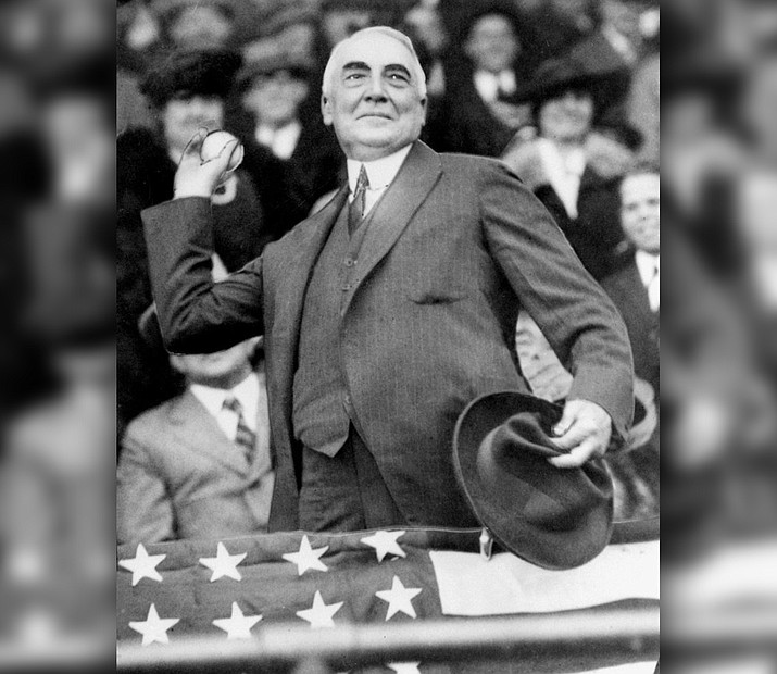 In this April 13, 1921, file photo, President Warren G. Harding throws out the first ball to open the Washington Senators' baseball season. The grandson of U.S. President Warren G. Harding has gone to court seeking to dig up the Republican's remains from the presidential memorial where they have lain since 1927. (AP Photo/FIle)