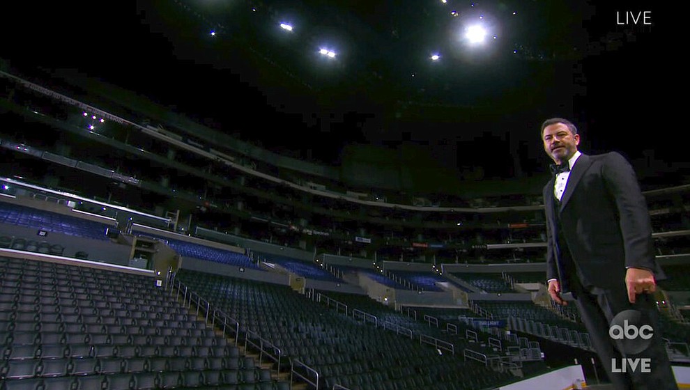 In this video grab captured on Sept. 20, 2020, courtesy of the Academy of Television Arts & Sciences and ABC Entertainment, host Jimmy Kimmel speaks on stage in front of empty seats during the 72nd Emmy Awards broadcast. (The Television Academy and ABC Entertainment via AP)