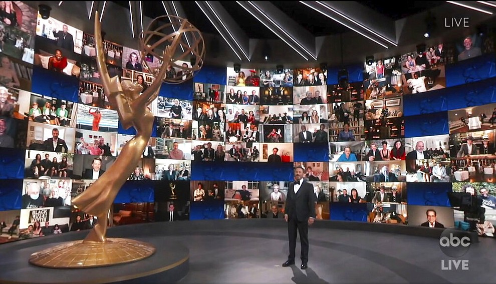 In this video grab captured on Sept. 20, 2020, courtesy of the Academy of Television Arts & Sciences and ABC Entertainment, host Jimmy Kimmel appears with a screen filled with nominees during the 72nd Emmy Awards broadcast. (The Television Academy and ABC Entertainment via AP)