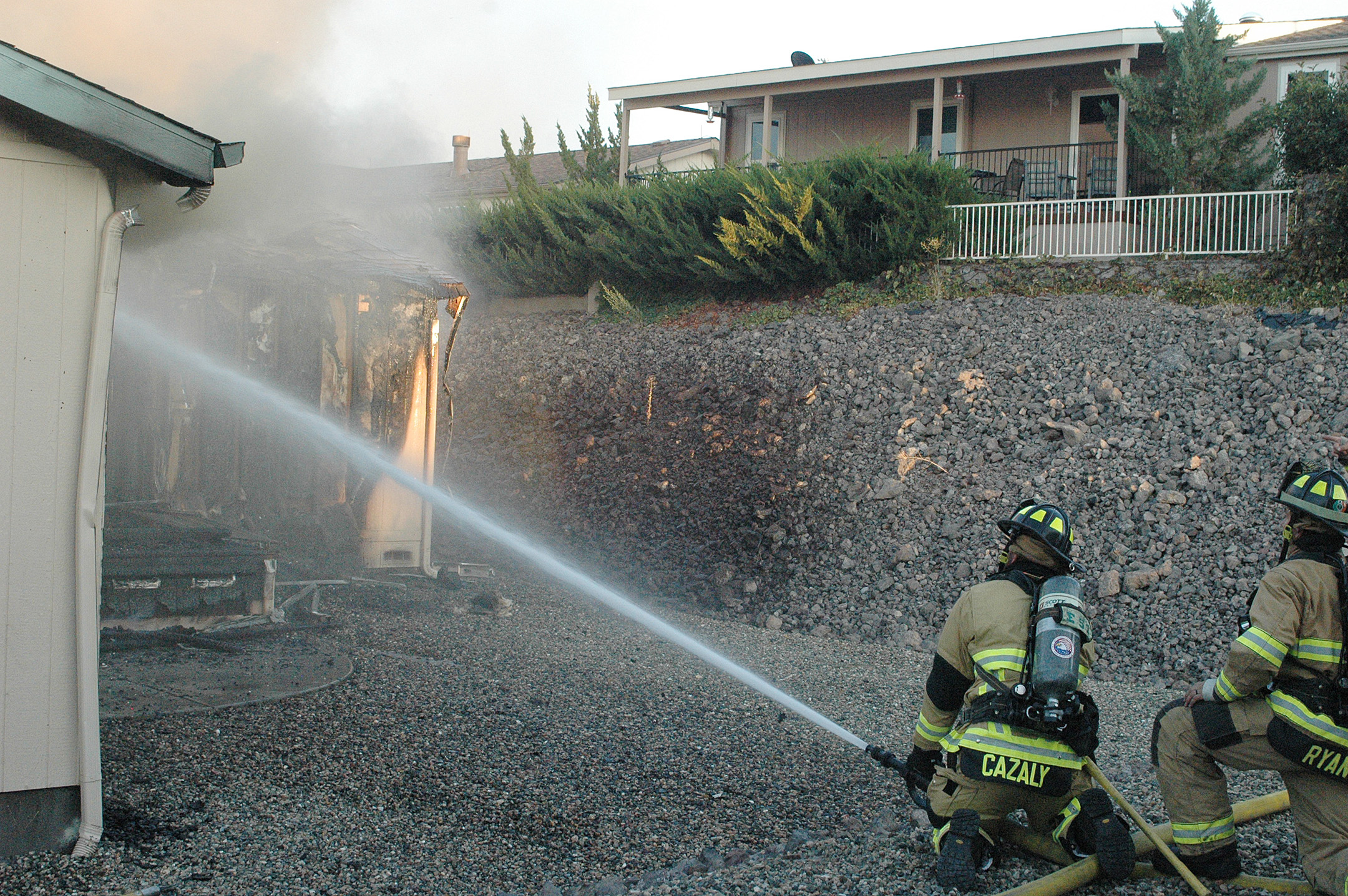 Witness says grill exploded; firefighters knock down house fire on