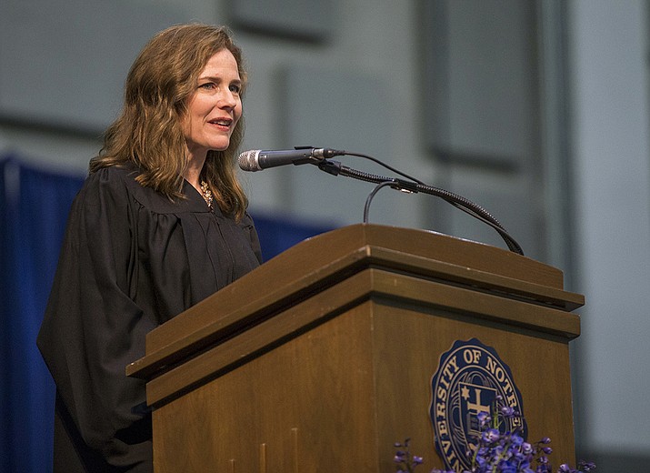In this May 19, 2018, file photo, Amy Coney Barrett, United States Court of Appeals for the Seventh Circuit judge, speaks during the University of Notre Dame's Law School commencement ceremony at the university, in South Bend, Ind. Barrett, a front-runner to fill the Supreme Court seat vacated by the death of Justice Ruth Bader Ginsburg, has established herself as a reliable conservative on hot-button legal issues from abortion to gun control. (Robert Franklin/South Bend Tribune via AP, File)