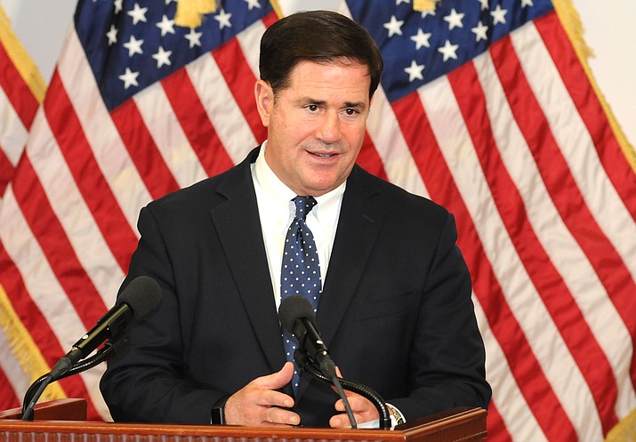 Gov. Doug Ducey answers questions Thursday about the spread of COVID-19 and how while he expects the infection rate to rise he does not intend to once again close any businesses. (Capitol Media Services photo by Howard Fischer)