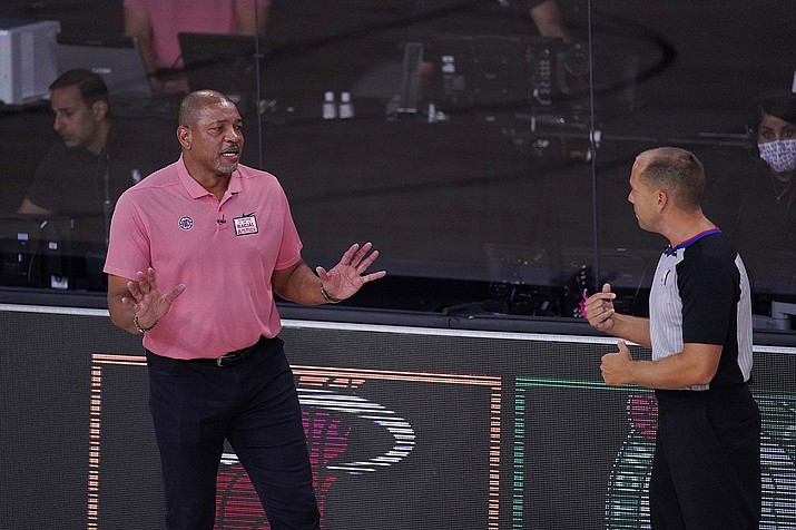 Los Angeles Clippers head coach Doc Rivers, left, questions a call during the first half of an NBA conference semifinal playoff basketball game against the Denver Nuggets, Tuesday, Sept. 15, 2020, in Lake Buena Vista, Fla. (Mark J. Terrill/AP)