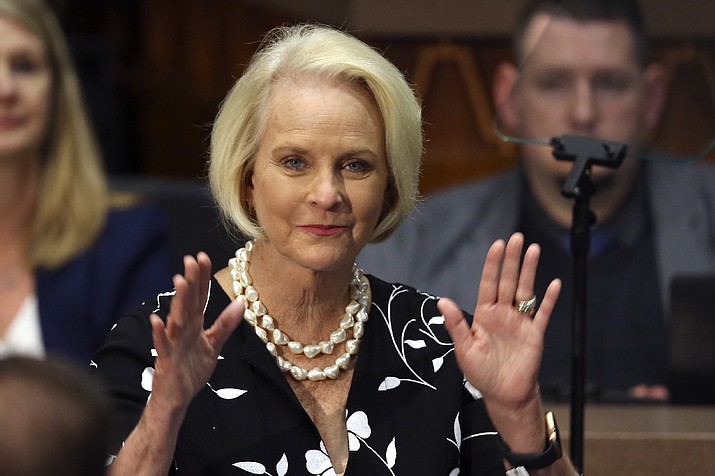 In this Jan. 13, 2020, file photo Cindy McCain, wife of former Arizona Sen. John McCain, waves to the crowd after being acknowledged by Arizona Republican Gov. Doug Ducey during his State of the State address on the opening day of the legislative session at the Capitol in Phoenix. Democratic presidential candidate former Vice President Joe Biden said Sept. 22 that Cindy McCain plans to endorse him for president. (Ross D. Franklin/AP, file)