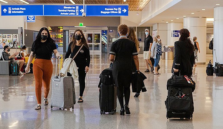 A number of U.S. airlines furloughed thousands of workers Thursday, one day after a federal aid package to help carriers through the coronavirus pandemic expired. Those included hundreds of furloughs at Phoenix Sky Harbor International Airport. (Photo by Allie Barton/Cronkite News)