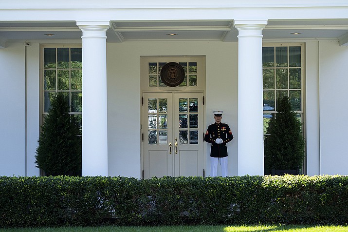 A Marine is posted outside the West Wing of the White House, signifying the President is in the Oval Office, Wednesday, Oct. 7, 2020, in Washington. (Evan Vucci/AP)
