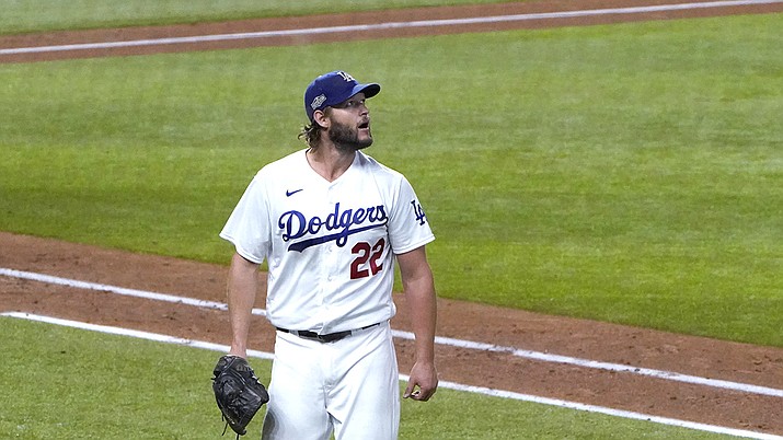 Los Angeles Dodgers starting pitcher Clayton Kershaw heads to the dugout after completing the top of the sixth inning against the San Diego Padres in Game 2 of a baseball National League Division Series Wednesday, Oct. 7, 2020, in Arlington, Texas. (AP Photo/Sue Ogrocki)
