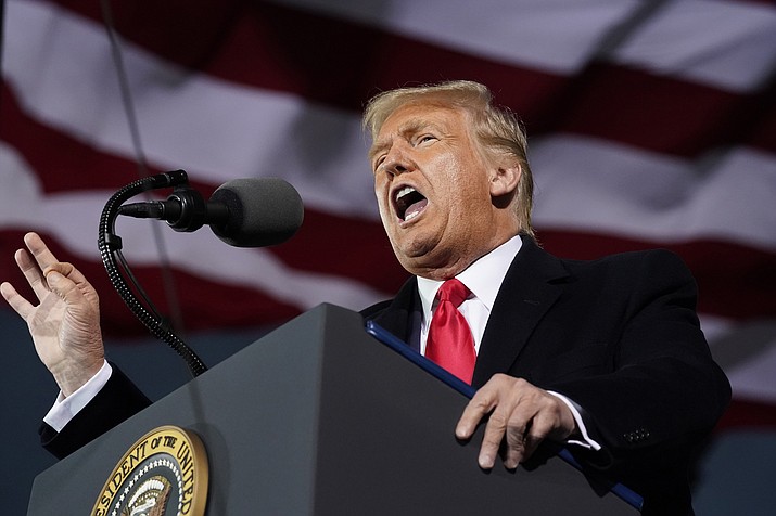 President Donald Trump speaks at a campaign rally at Des Moines International Airport, Wednesday, Oct. 14, 2020, in Des Moines, Iowa. Trump is returning to battleground Arizona for appearances in Tucson and Prescott, his campaign announced Thursday. (Alex Brandon/AP)