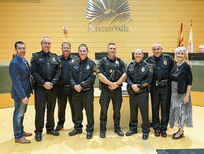 From left, Mayor Kell Palguta stands with PVPD Sgt. Ryan Spriggs, Chief Steve Roser, Sgt. Danny Eller, Sgt. Scott Rudolph, Sgt. Jeremy Martin and Lt. Jason Kaufman during a promotion ceremony at PV Town Council’s study session Oct. 15, 2020 at the Library Auditorium. Vice Mayor Lora Lee Nye is also pictured. (Town of Prescott Valley/Courtesy)