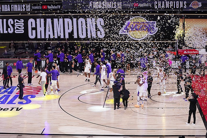 The Los Angeles Lakers players celebrate after the Lakers defeated the Miami Heat 106-93 in Game 6 of basketball's NBA Finals Sunday, Oct. 11, 2020, in Lake Buena Vista, Fla. (Mark J. Terrill/AP)