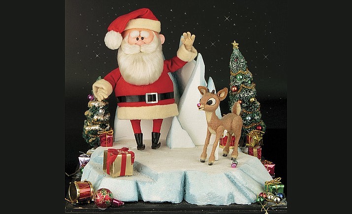This image released by Profiles in History shows a Santa Clause and Rudolph reindeer puppet used in the filming of the 1964 Christmas special "Rudolph the Red-Nosed Reindeer." The soaring reindeer and Santa Claus figures who starred in the perennially beloved stop-motion animation Christmas special “Rudolph the Red-Nosed Reindeer” are going up for auction. Auction house Profiles in History announced this week that a 6-inch-tall Rudolph and 11-inch-tall Santa used to animate the 1964 TV special are being sold together in the auction that starts Nov. 13 and are expected to fetch between $150,000 and $250,000. (Profiles in History via AP)