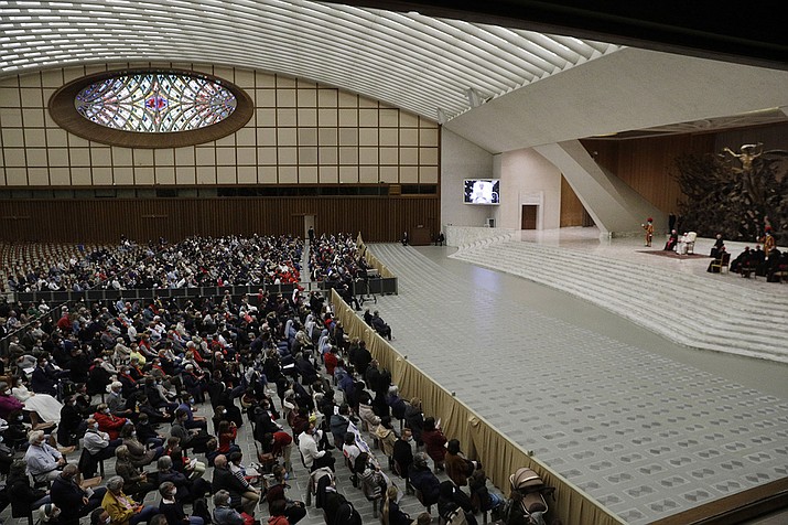 Faithful gather in the Paul VI hall during Pope Francis weekly general audience at the Vatican, Wednesday, Oct. 21, 2020. The Vatican is putting an end to Pope Francis’ general audiences with the public amid a surge in coronavirus cases in Italy and a confirmed infection at Oct. 21 encounter. The Vatican said Thursday that Francis would resume livestreaming his weekly catechism lessons from his library in the Apostolic Palace, as he did during the Vatican’s COVID-19 lockdown over the spring and summer. (Gregorio Borgia/AP)