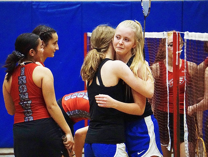 Prescott doubles team Kailey Crockett, left, and Cassideen Naylor, right, console each other after losing their match against Ironwood during the state semifinals on Wednesday, Nov. 11, 2020, in Prescott’s Auxiliary Gym. Ironwood won the match, eliminating the Badgers from state title contention and ending their season. (Aaron Valdez/Courier)