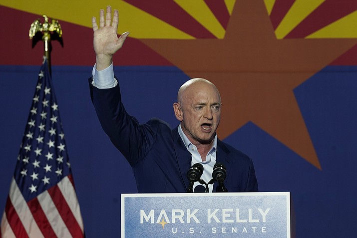 Senator-elect Mark Kelly waves to supporters as he speaks during an election-night event Tuesday, Nov. 3, 2020 in Tucson (Ross D. Franklin/AP)