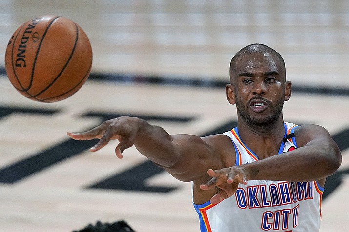 Chris Paul makes a pass during the first half of an NBA first-round playoff basketball game against the Houston Rockets in Lake Buena Vista, Fla., in this Wednesday, Sept. 2, 2020, file photo. Paul, who was traded to the Suns Nov. 16, will play alongside one of the league's most dynamic young scorers in fellow All-Star Devin Booker. (Mark J. Terrill, AP File)