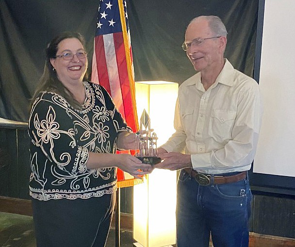 Larry Gray receives PAL 2020 Man of the Year Award from PAL President Amora Cianciola during a live-streamed ceremony earlier this month. (Prescott Area Leadership/Courtesy)