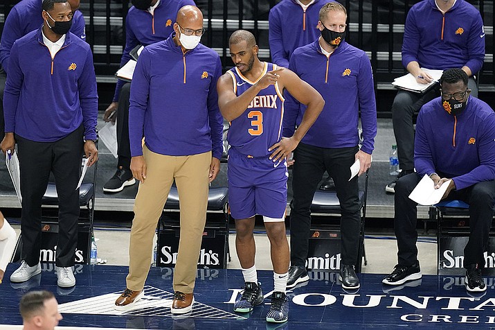 Phoenix Suns head coach Monty Williams speaks with Chris Paul (3) during the second half of an NBA preseason basketball game Monday, Dec. 14, 2020, in Salt Lake City. (Rick Bowmer/AP)