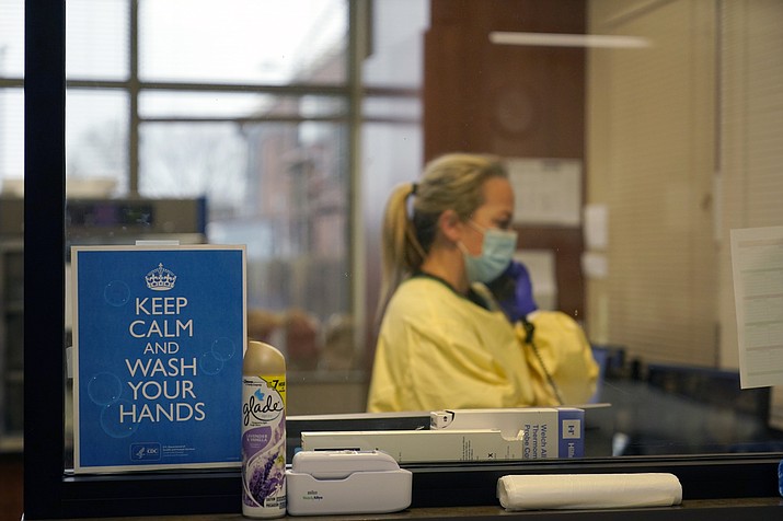 In this Nov. 24, 2020, file photo, registered nurse Chrissie Burkhiser works in the emergency room at Scotland County Hospital in Memphis, Mo. Scientists say there is reason for concern but not alarm about new strains of the coronavirus, especially the one currently spreading in England. (Jeff Roberson, AP File)