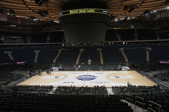 In this March 12, 2020, file photo, Madison Square Garden in New York sits empty after NCAA college basketball games in the men's Big East Conference tournament were cancelled due to concerns about the coronavirus. With the virus raging in March, several conferences called off their postseason basketball tournaments, and the NCAA canceled the billion-dollar bonanza known as March Madness, proceeds from which trickle down in some form to almost every Division I school in America. ( Mary Altaffer, AP File)