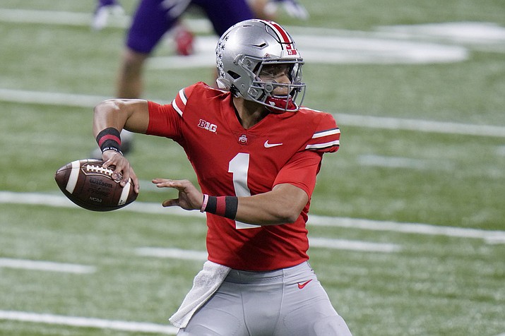 In this Saturday, Dec. 19, 2020, file photo, Ohio State quarterback Justin Fields throws during the first half of the Big Ten championship NCAA college football game against Northwestern, in Indianapolis. (AJ Mast/AP, file)