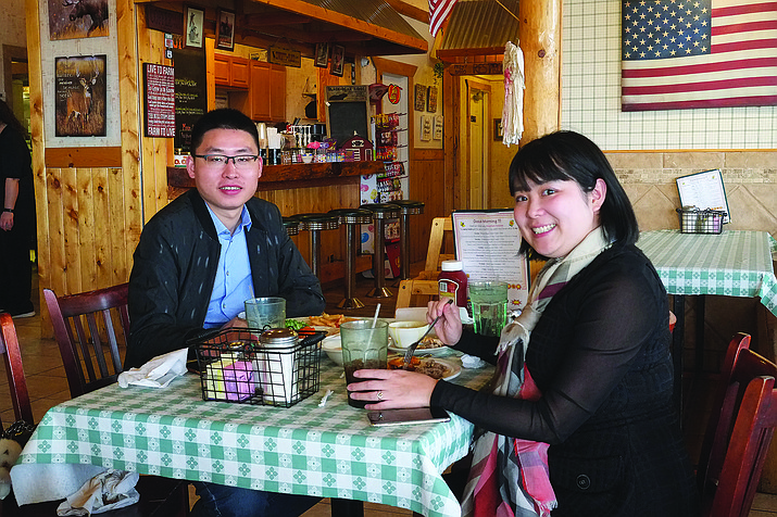 A couple enjoys a meal at Pine Country Restaurant in Williams. Many businesses are set to bump wages in 2021. (Loretta McKenney/WGCN)