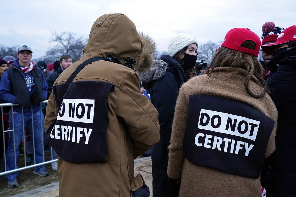 People wait to hear speakers Wednesday, Jan. 6, 2021, in Washington, at a rally in support of President Donald Trump called the "Save America Rally." (AP Photo/Jacquelyn Martin)