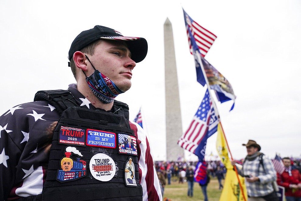 Trump supporters gather on the Washington Monument grounds in advance of a rally Wednesday, Jan. 6, 2021, in Washington. As Congress prepares to affirm President-elect Joe Biden's victory, thousands of people have gathered to show their support for President Donald Trump and his baseless claims of election fraud. (AP Photo/John Minchillo)