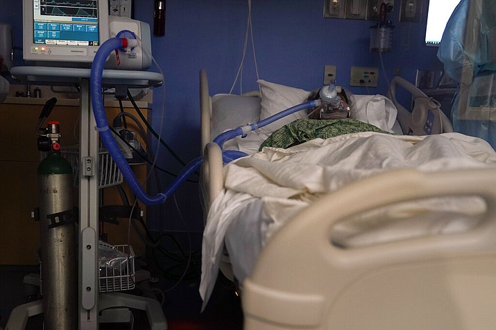 A COVID-19 patient, placed on a ventilator, rests at St. Joseph Hospital in Orange, California, Thursday, Jan. 7, 2021. The United States topped 4,000 virus deaths in a single day for the first time, breaking a record set just one day earlier, with several Sun Belt states driving the surge.. (Jae C. Hong/AP)