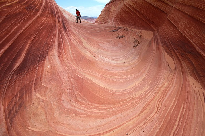 Outdoor enthusiasts and nature photographers hoping to explore the colorful, contoured landscape of the hugely popular trail in the U.S. Southwest will now have a better chance at landing one of the elusive permits after the U.S. government Jan. 11,2021 tripled the number of daily visitors allowed. (AP Photo/Brian Witte, File)