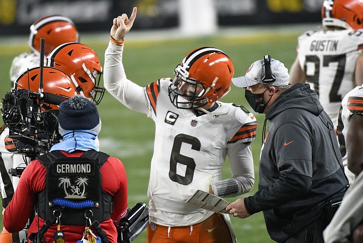 Cleveland Browns offensive coordinator Alex Van Pelt, right, talks with quarterback Baker Mayfield (6) on the sideline during the second half of an NFL wild-card playoff football game against the Pittsburgh Steelers in Pittsburgh, Sunday, Jan. 10, 2021. (Don Wright/AP)