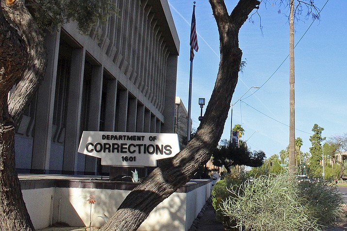 In this March 16, 2016, file photo, is the Arizona Department of Corrections, Rehabilitation and Reentry headquarters in Phoenix. Prison officials will start offering COVID-19 vaccinations on Friday, Jan. 15, 2021, to corrections officers at the Perryville prison in Goodyear, with other prisons to follow in the future. State corrections officers can get vaccinated through either the corrections department or through counties where they work, some of which are already making vaccines available to them. (Bob Christie, AP File)